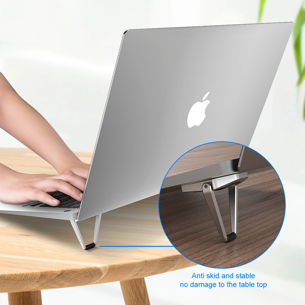 vertical laptop stand on a small desk