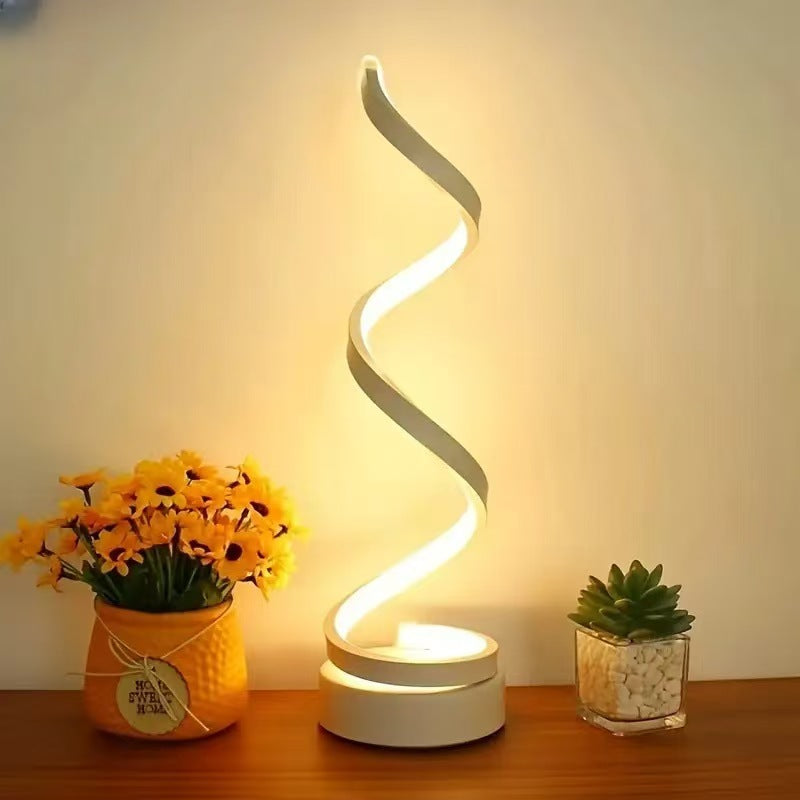 usb spiral desk lamp for small workspaces used in a home office workspace