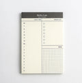 daily desk planner notepad for small desk setup used in a home office workspace