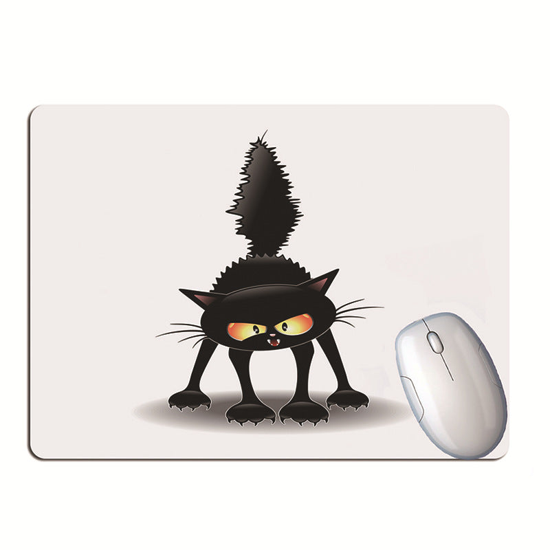 black cat desk mat for keyboard and mouse on a clean desk setup