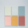 warm color sticky memo notes for desk planning on a clean desk setup