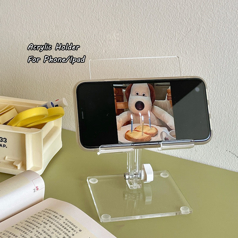 clear acrylic phone and tablet stand detail for desk setup