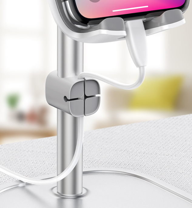 adjustable metal tablet stand for desk used in a home office workspace