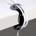 desk edge cable winder and hub clip on a clean desk setup