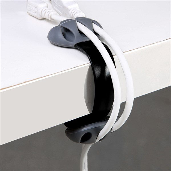 desk edge cable winder and hub clip on a clean desk setup