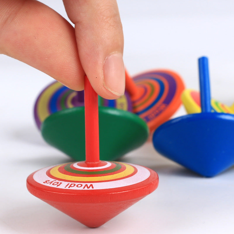 wooden spinning top stress relief desk toy used in a home office workspace