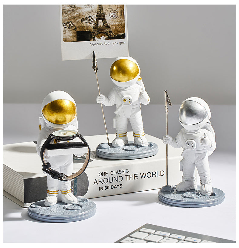 astronaut note holder on a small desk