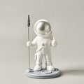 astronaut memo clip holding a desk note