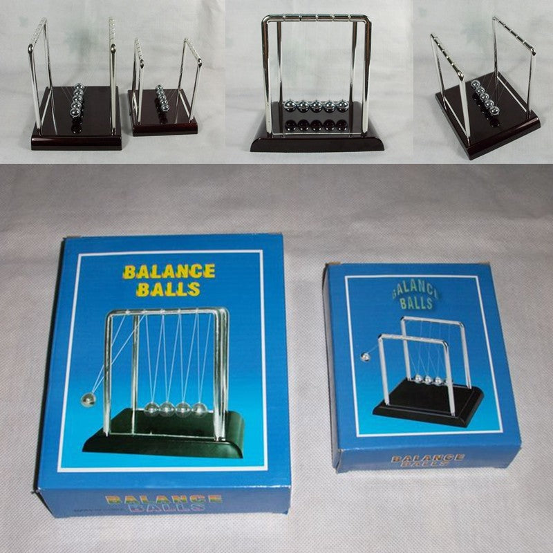 newton ball desk toy for stress relief used in a home office workspace