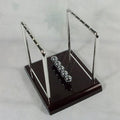 newton ball desk toy for stress relief on a clean desk setup