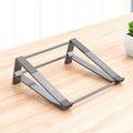 close up of portable aluminum laptop stand for desk setup for small desk organization