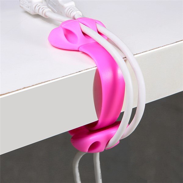 close up of desk edge cable winder and hub clip for small desk organization