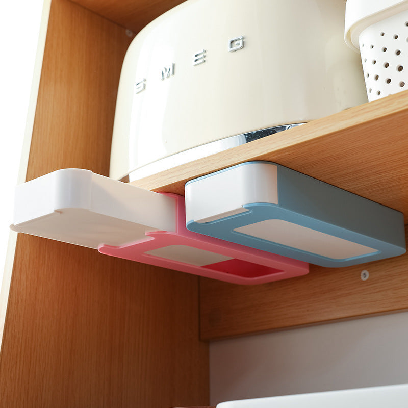 stick-on under-desk pen drawer on a clean desk setup