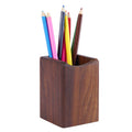 wooden pen holder for desk organization on a clean desk setup