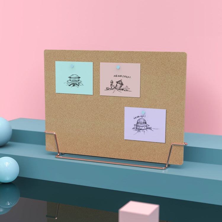 cork memo board for reminders on a small desk