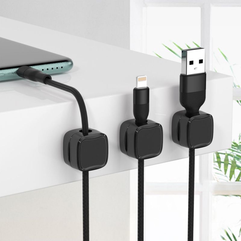 magnetic cable clips used in a home office desk setup