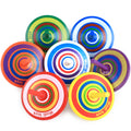 wooden spinning top stress relief desk toy on a clean desk setup