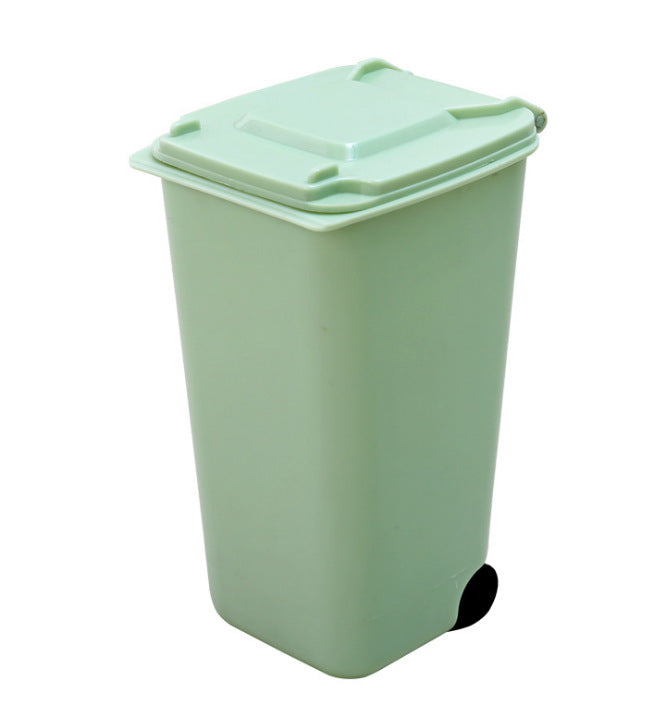 mini desktop trash bin for small desk setups used in a home office workspace