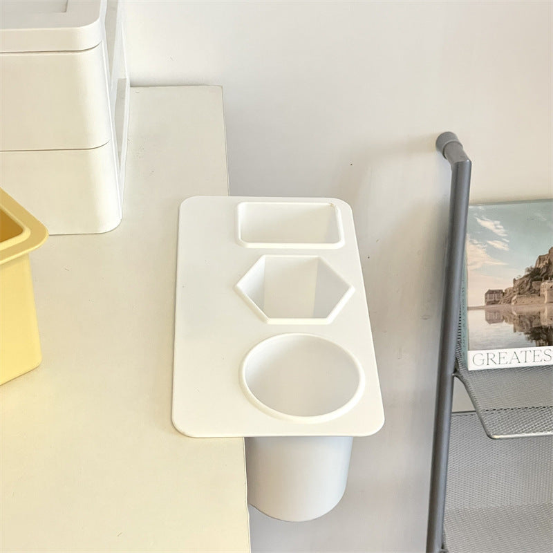 multifunctional pen holder on an organized desk