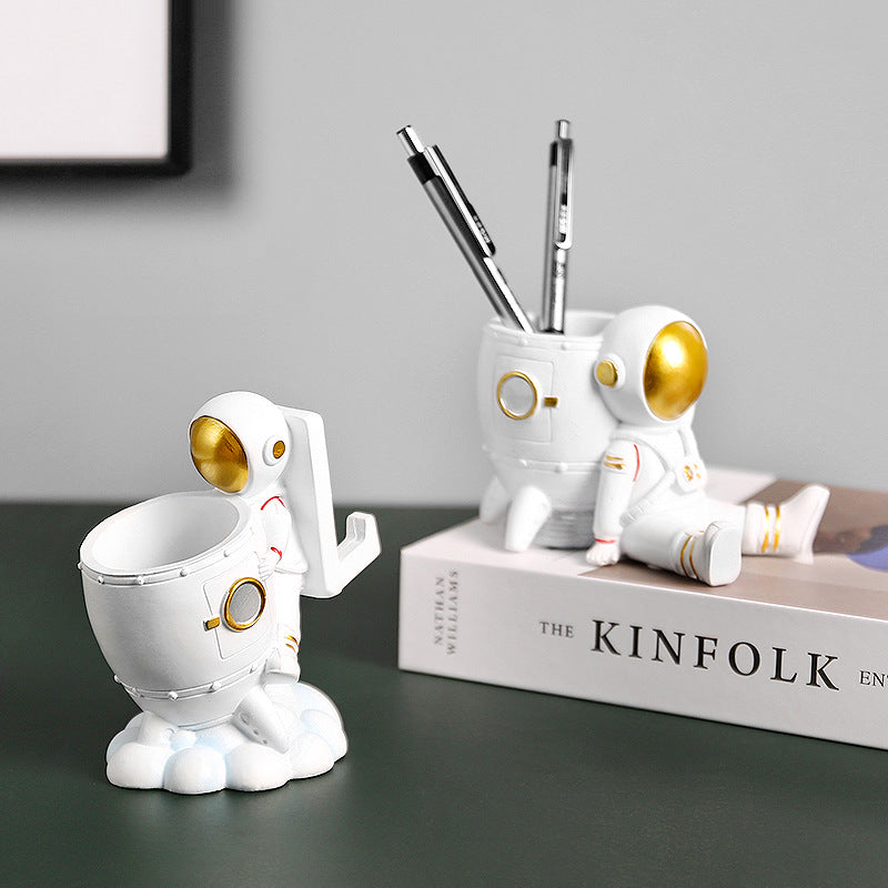 creative astronaut pen holder for workspace