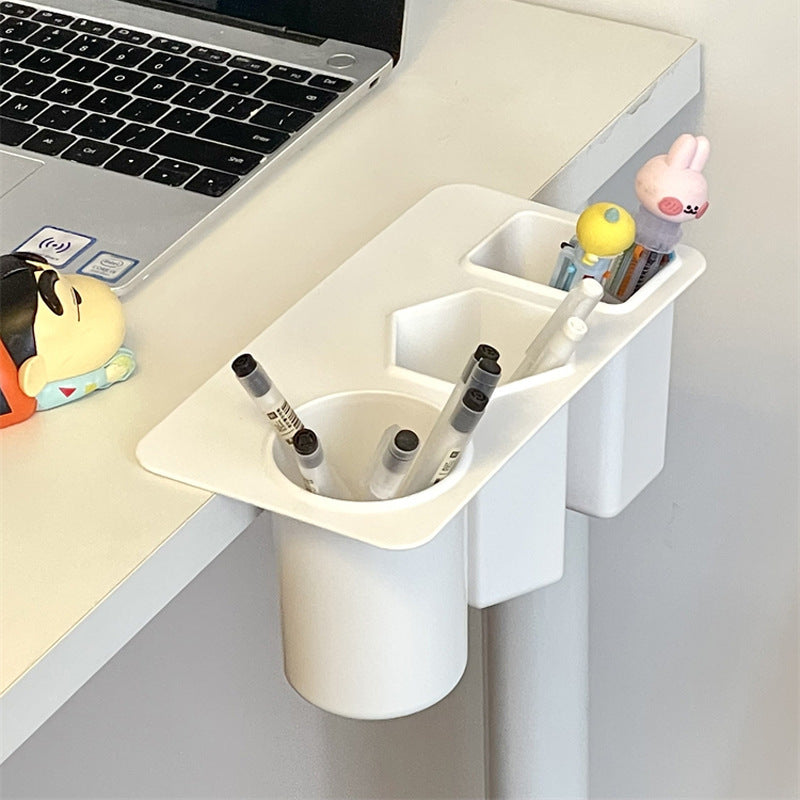 desk organizer holding pens and office items
