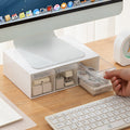 monitor stand riser with drawer on a desk