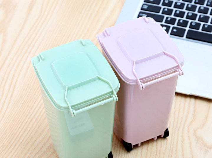 close up of mini desktop trash bin for small desk setups for small desk organization