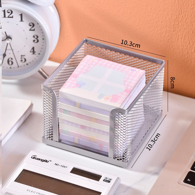 wire-mesh sticky note organizer on a desk