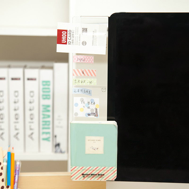 acrylic monitor memo board beside a screen