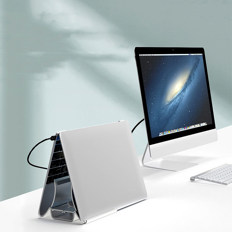 vertical laptop storage stand for desk used in a home office workspace